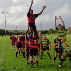 Pinner (red & black) hoist Netanel Lawrence-Ojo up in a lineout